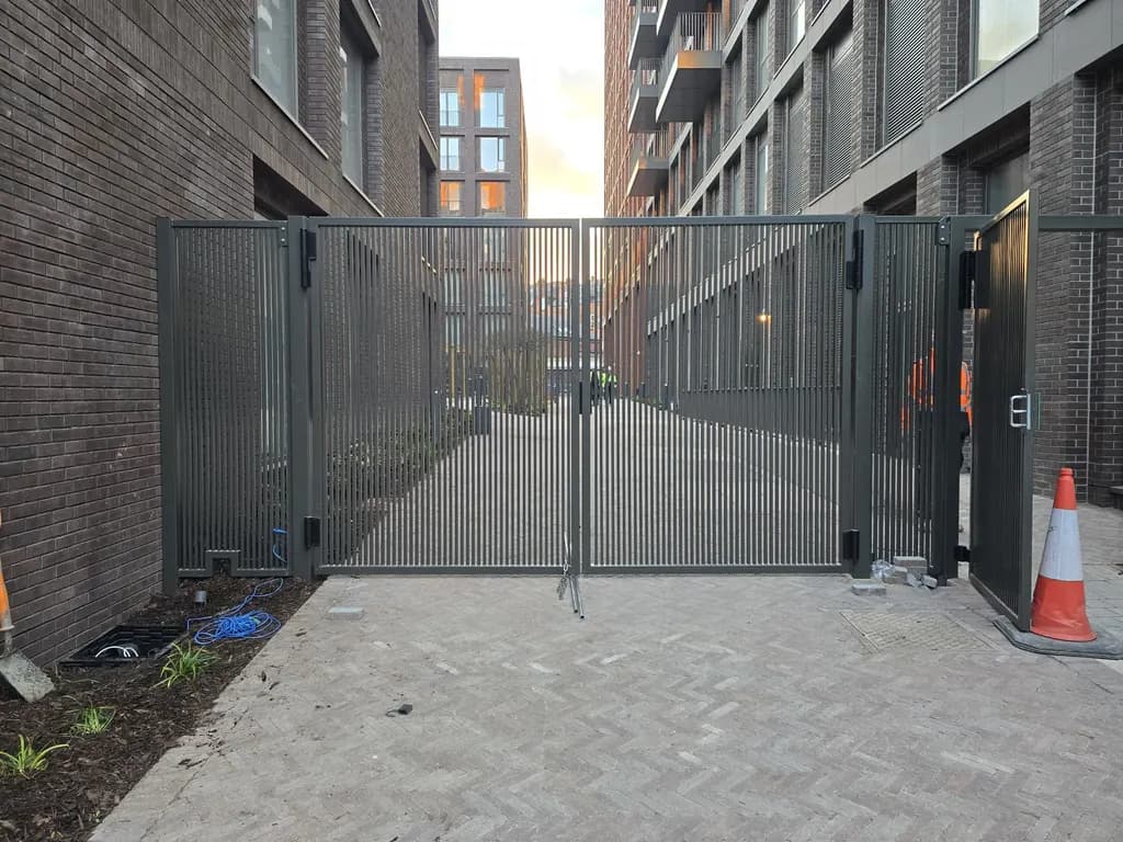 Mesh gates closing the courtyard entrance of an apartment development
