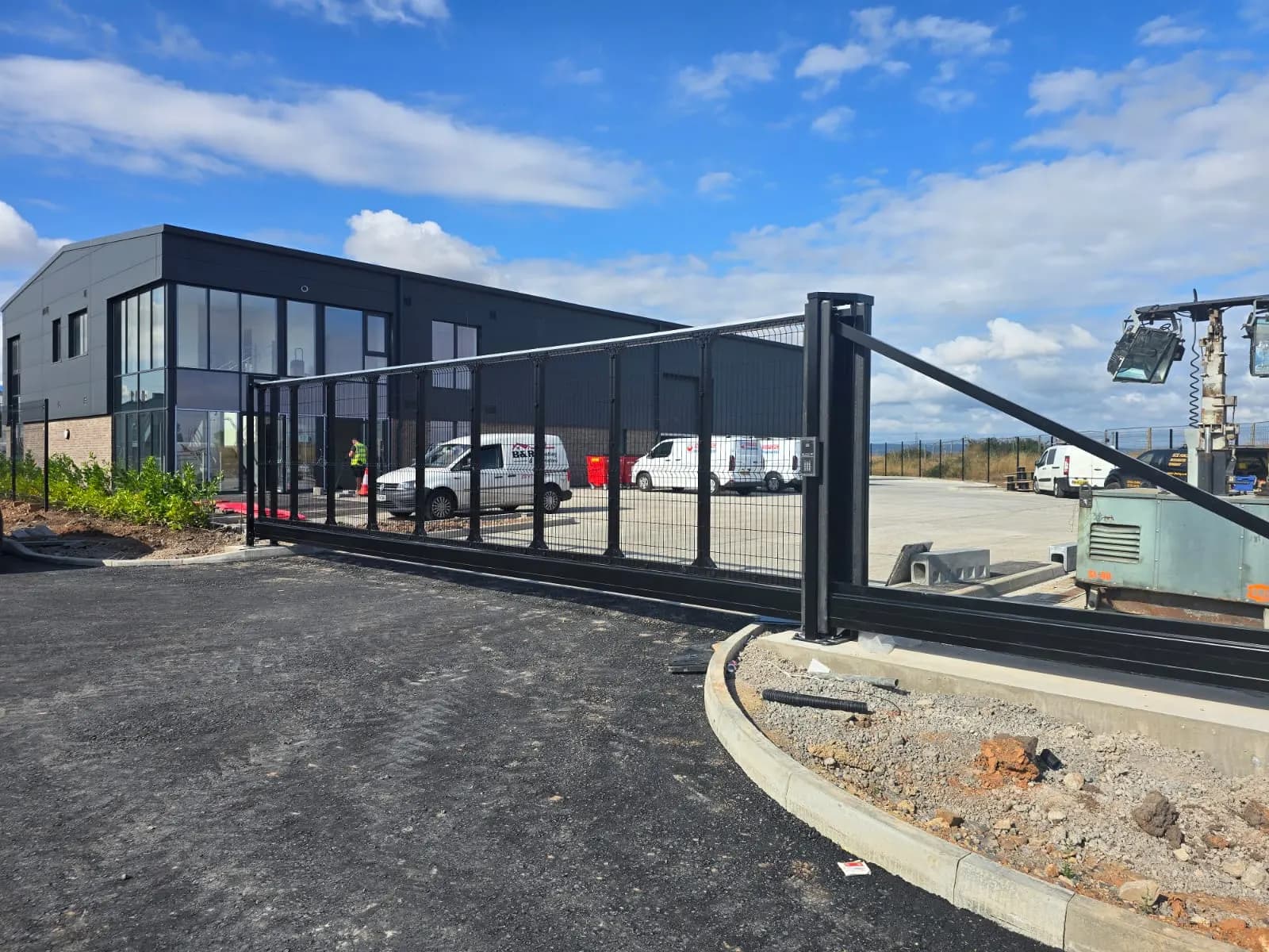 Cantilever sliding gate at the entrance to an office and warehouse site