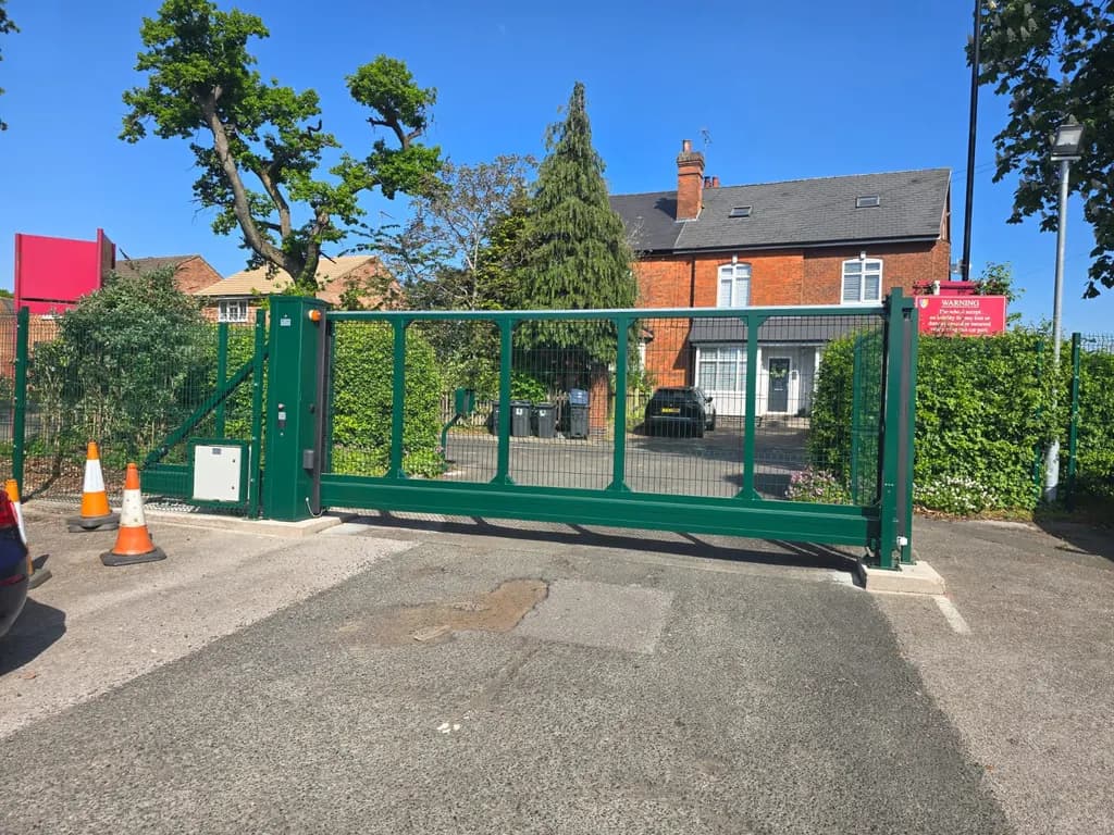 Green bar gates controlling vehicle access from a residential street