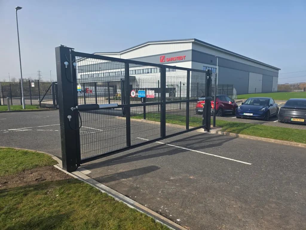 Mesh-infill sliding gate at the entrance to a commercial unit