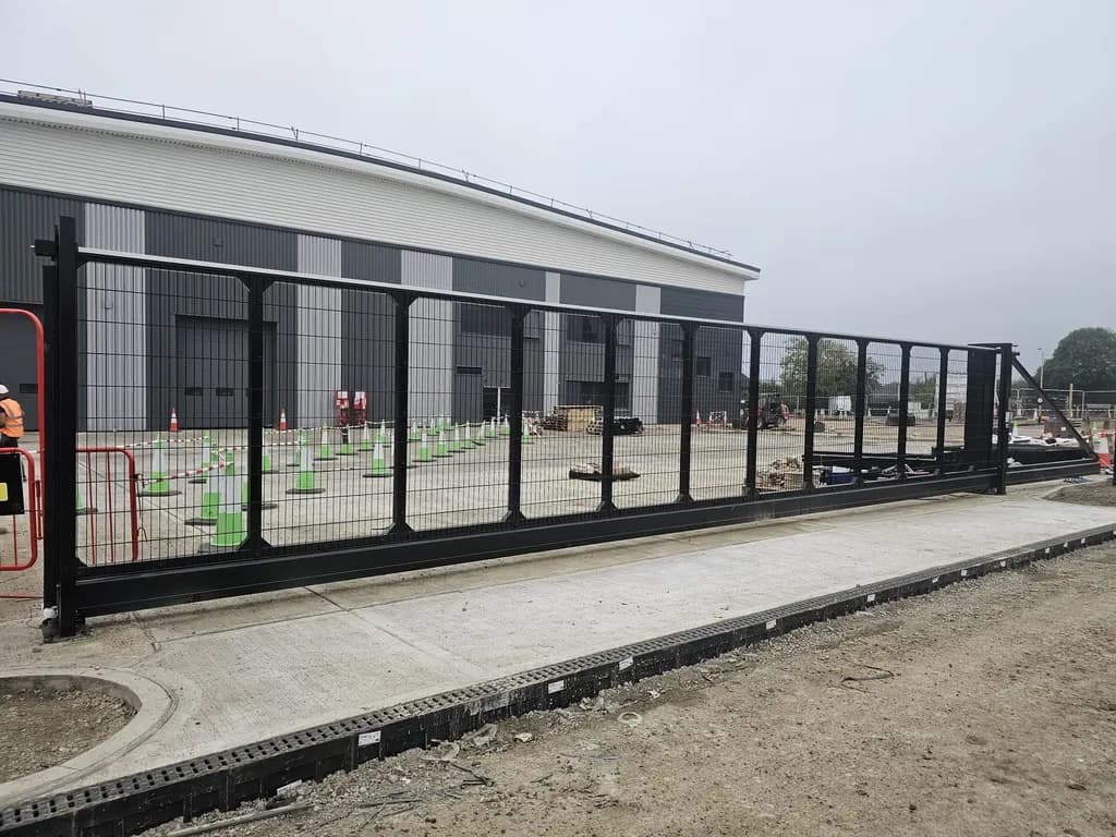 Mesh sliding gate at a newly built industrial unit