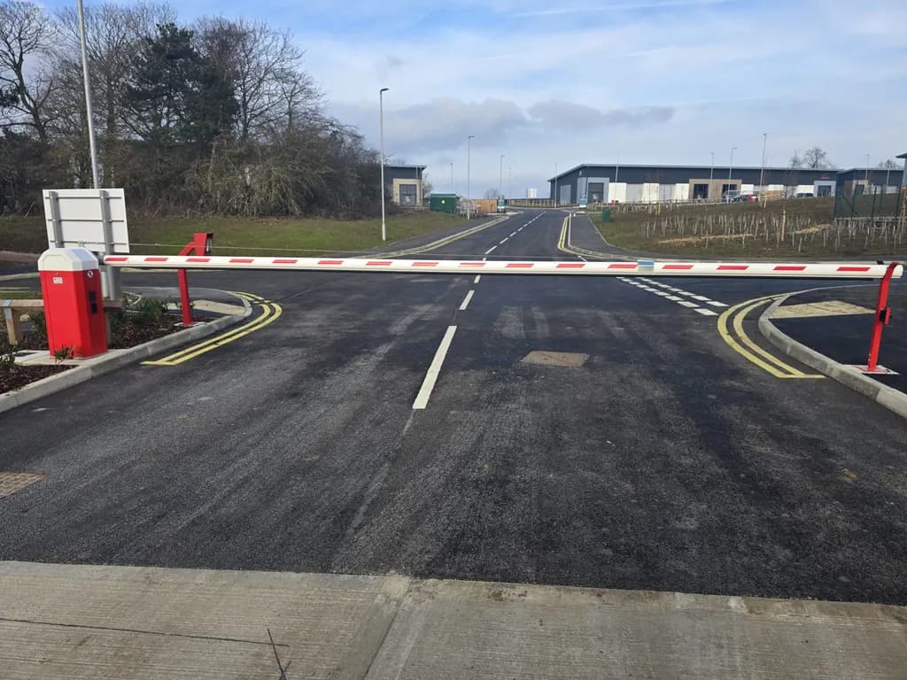 Rising-arm barrier installed on a newly surfaced access road